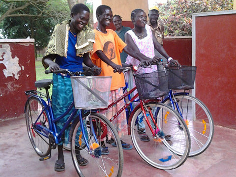 group of african women with bicycles