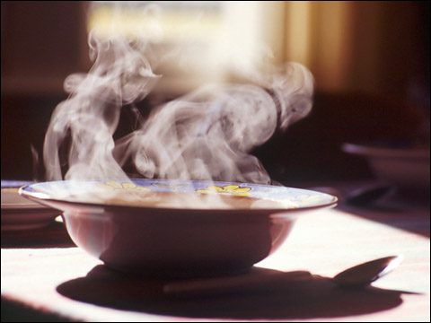 dark moody steaming bowl of soup