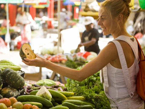blonde woman shopping at farmers market