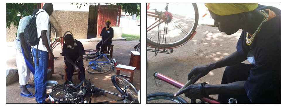 group of african men repairing bicycles