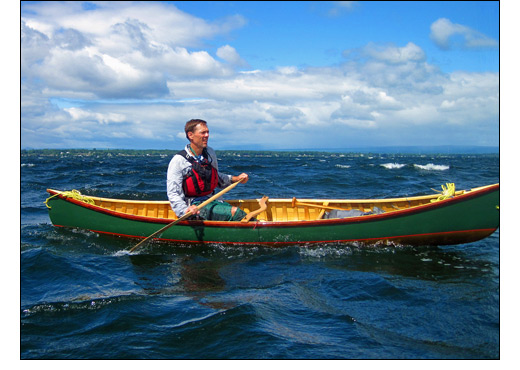 man in canoe on water