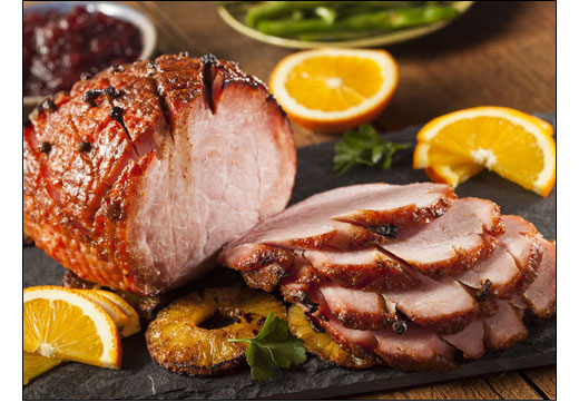 glazed sliced ham on platter