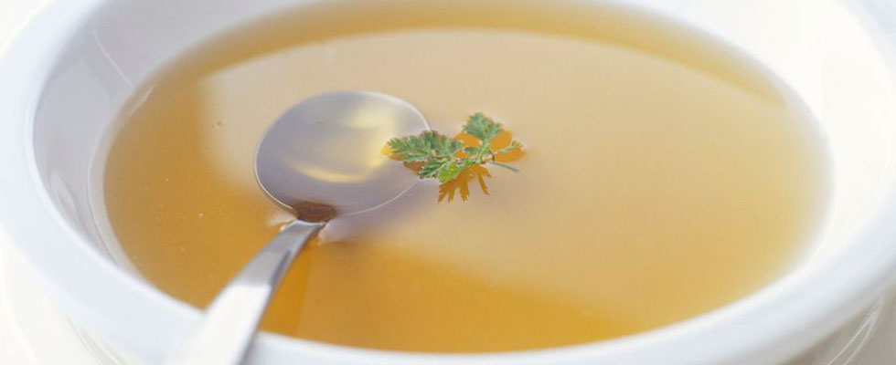 close up bowl of broth